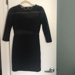 Black fitted dress with sheer strips